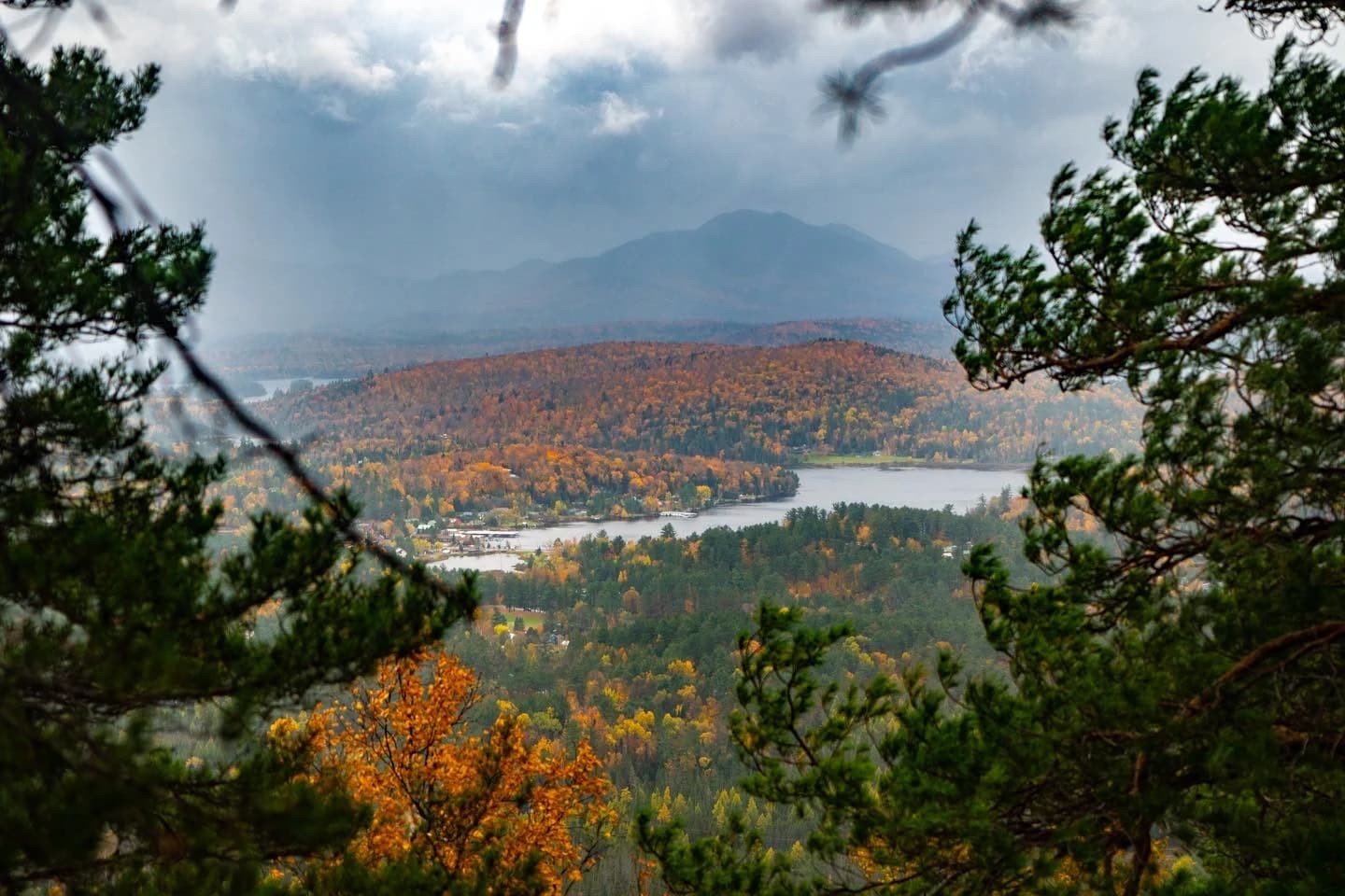 Autumn lake and mountains softened by low cloud and fog